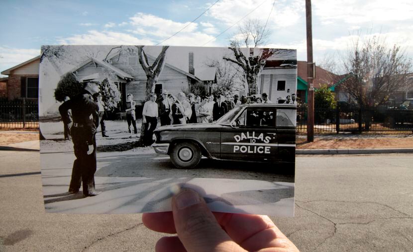 A 1963 photo by Darryl Heikes of the Dallas Times Herald is held up against the spot where...