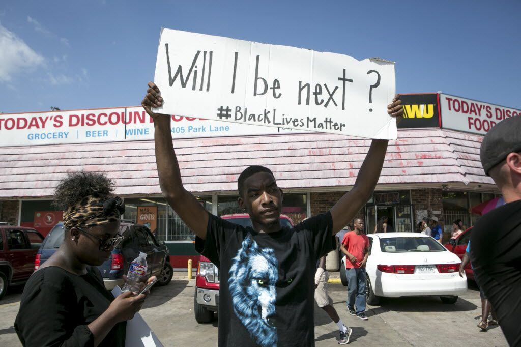 Niamke Ledbetter demonstrates with a group of Black Lives Matter supporters in Dallas, July...