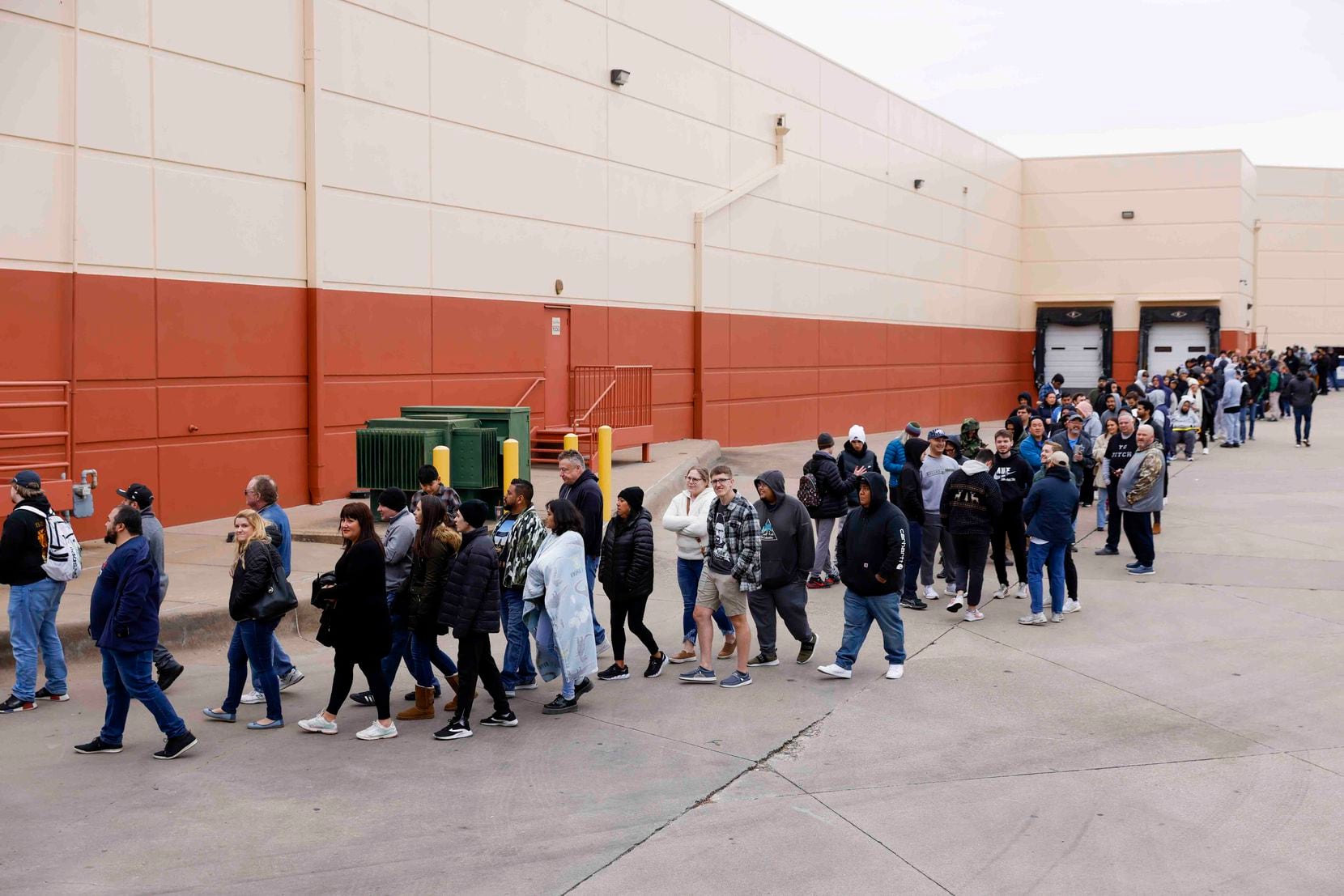 Hundreds of people wait in line to get a glimpse of actors Bryan Cranston and Aaron Paul...