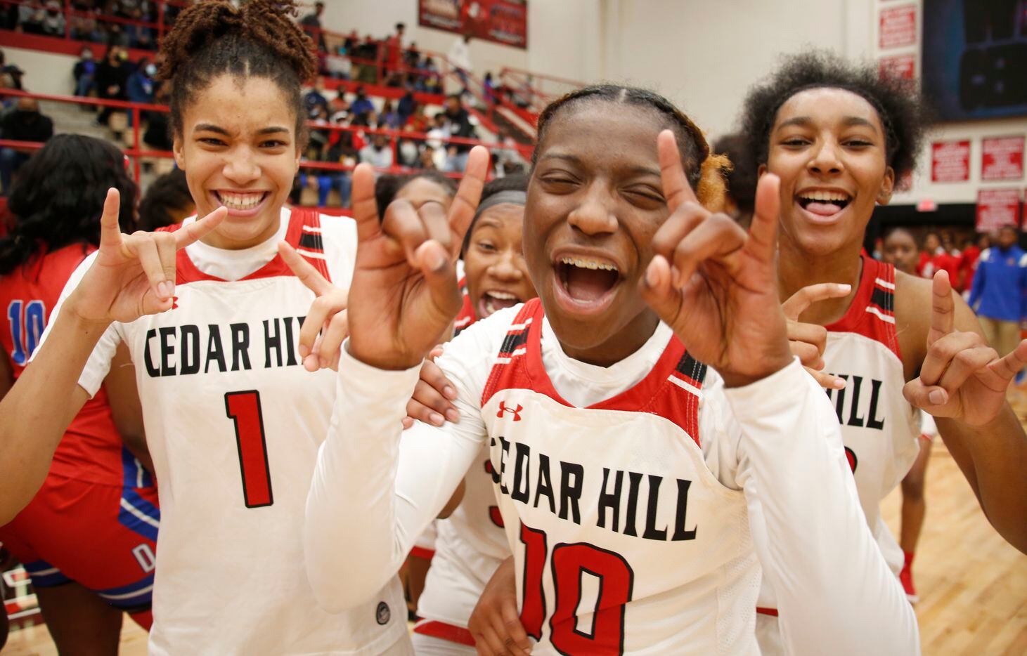 Cedar Hill players celebrate after their 80-72 victory over Duncanville. The two teams played their District 11-6A girls basketball game at Cedar Hill High School in Cedar Hill on January 14, 2022. (Steve Hamm/ Special Contributor)