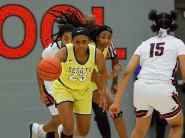 DeSoto’s Kendall Brown (23) pushes the ball past Sachse’s Londyn Oliphant (15) during the...