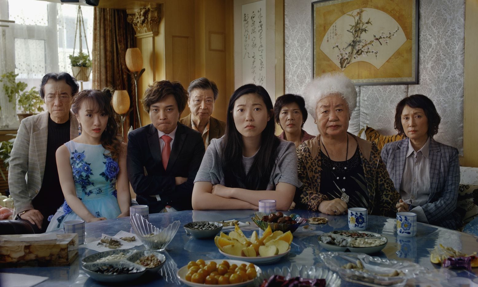 Billi (Awkwafina, center) and her extended family (from left: Jiang Yongbo, Aoi Mizuhara,...