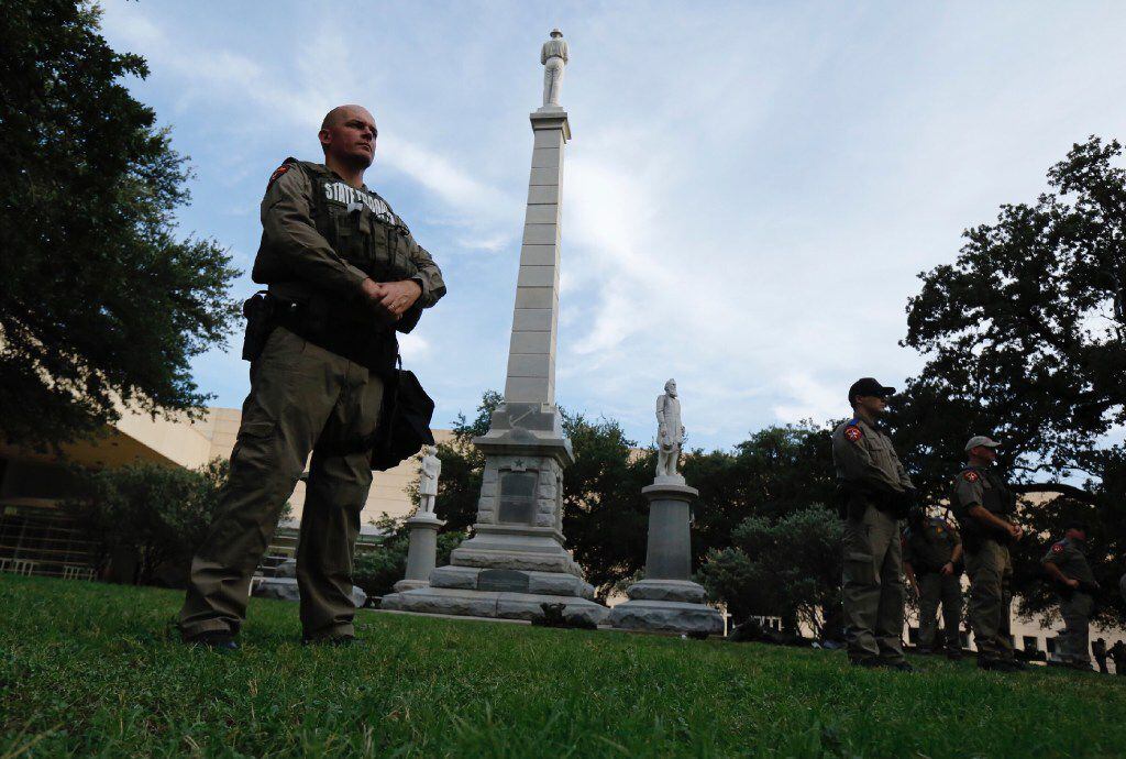 Texas state troopers guarded the Confederate War Memorial before the March Against White...