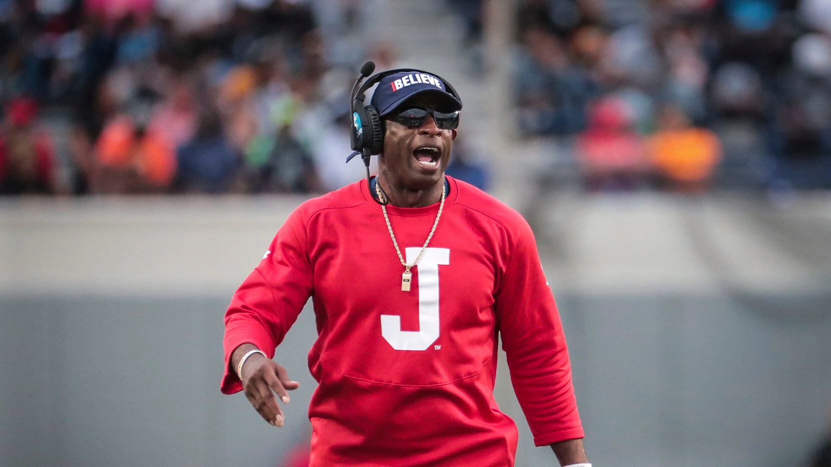 FILE - Jackson State coach Deion Sanders gets his team's attention during the Southern...
