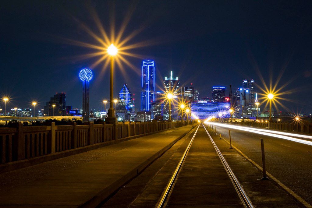 The downtown Dallas skyline lights up in blue in recognition of National Police Week as seen...