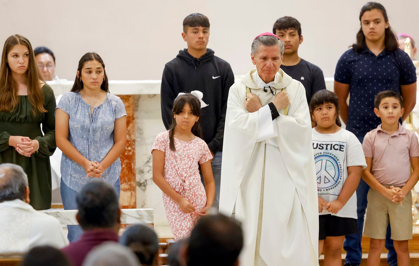 Archbishop Gustavo García-Siller signs love honoring the 19 children and two adults lost in...
