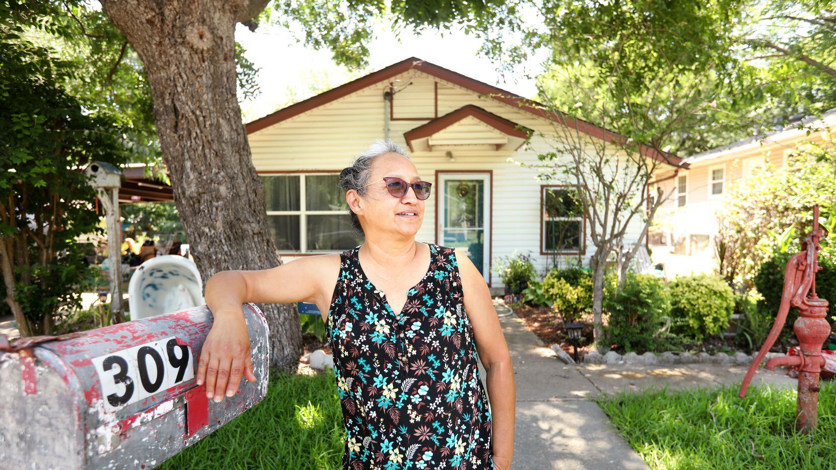 Silvia Escamilla poses for a photograph at her home in the La Loma neighborhood of McKinney...