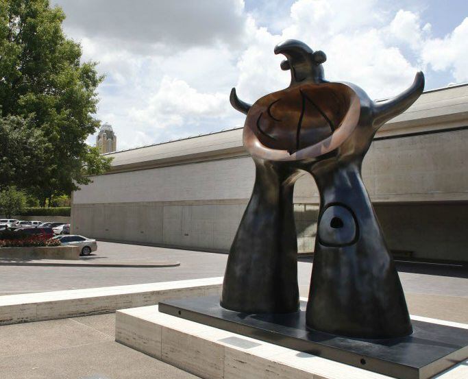 The Kimbell Art Museum in Fort Worth's cultural district. In the foreground is "Woman...