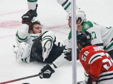 Dallas Stars center Tyler Seguin (91) falls on the ice and loses his helmet during a play in...
