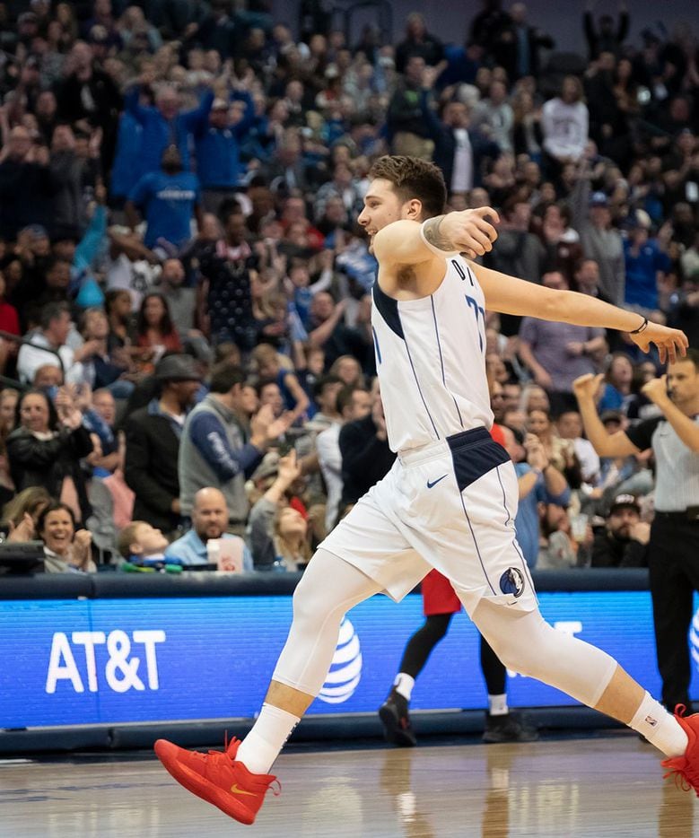 Dallas Mavericks forward Luka Doncic celebrates after hitting a 3-pointer during the second...