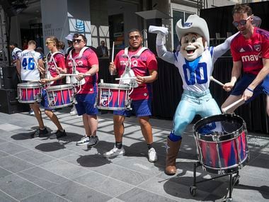 Dallas Cowboys mascot Rowdy pumps up the crowd with the FC Dallas drumline before Dallas was...