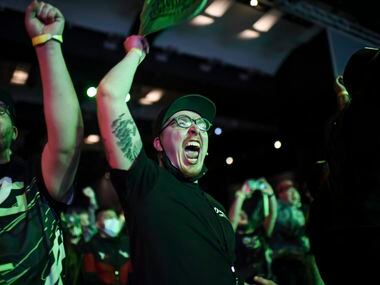 A fan cheers as OpTic Texas wins the match over the Atlanta FaZe during OpTic Texas' Call of...