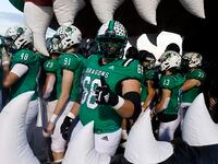 Southlake Carroll offensive lineman Arthur Clayton (66) gives a thumbs up before being...