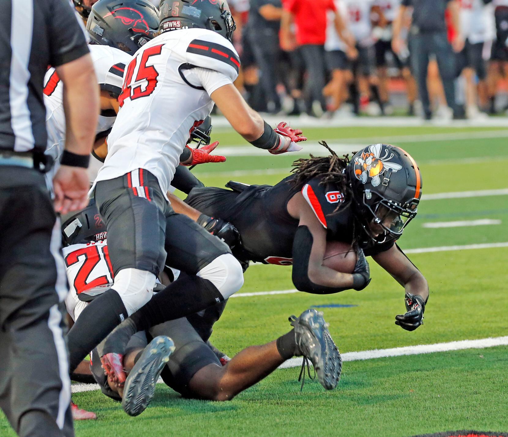Rockwall High RB Ashten Emory (6) takes the ball in for the first Yellowjacket touchdown...