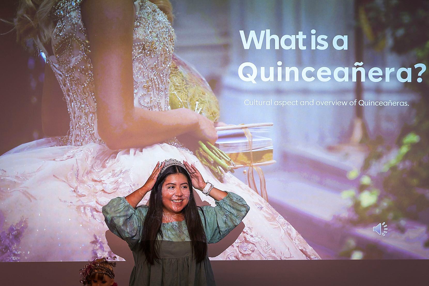 Alondra Ramirez adjusts her tiara before beginning a presentation during a Heritage Festival...