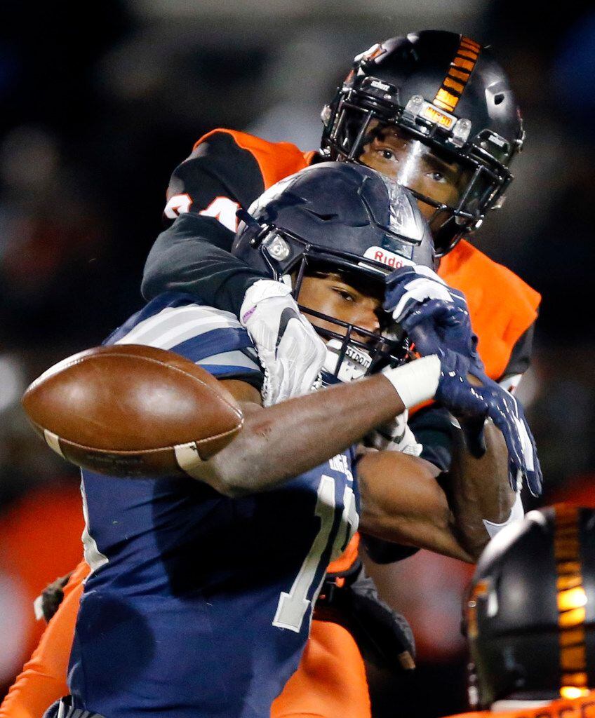 Frisco Lone Star Marvin Mims (18) has his fourth quarter pass knocked away by Lancaster defensive back Andre Dibbles (24) during their Class 5A Division I Regional championship at Wilkerson-Sanders Stadium in Rockwall, Texas, Friday, December 6, 2019. (Tom Fox/The Dallas Morning News)