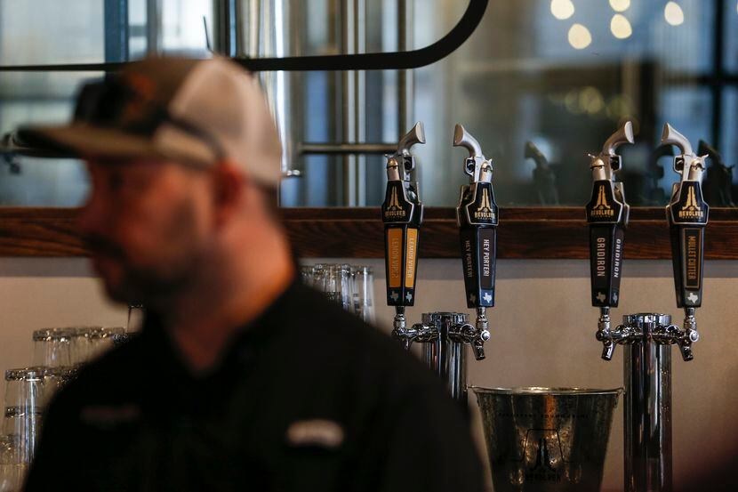 Beer taps are seen at Revolver Brewing BLDG 5, a new working brewery at Texas Live.