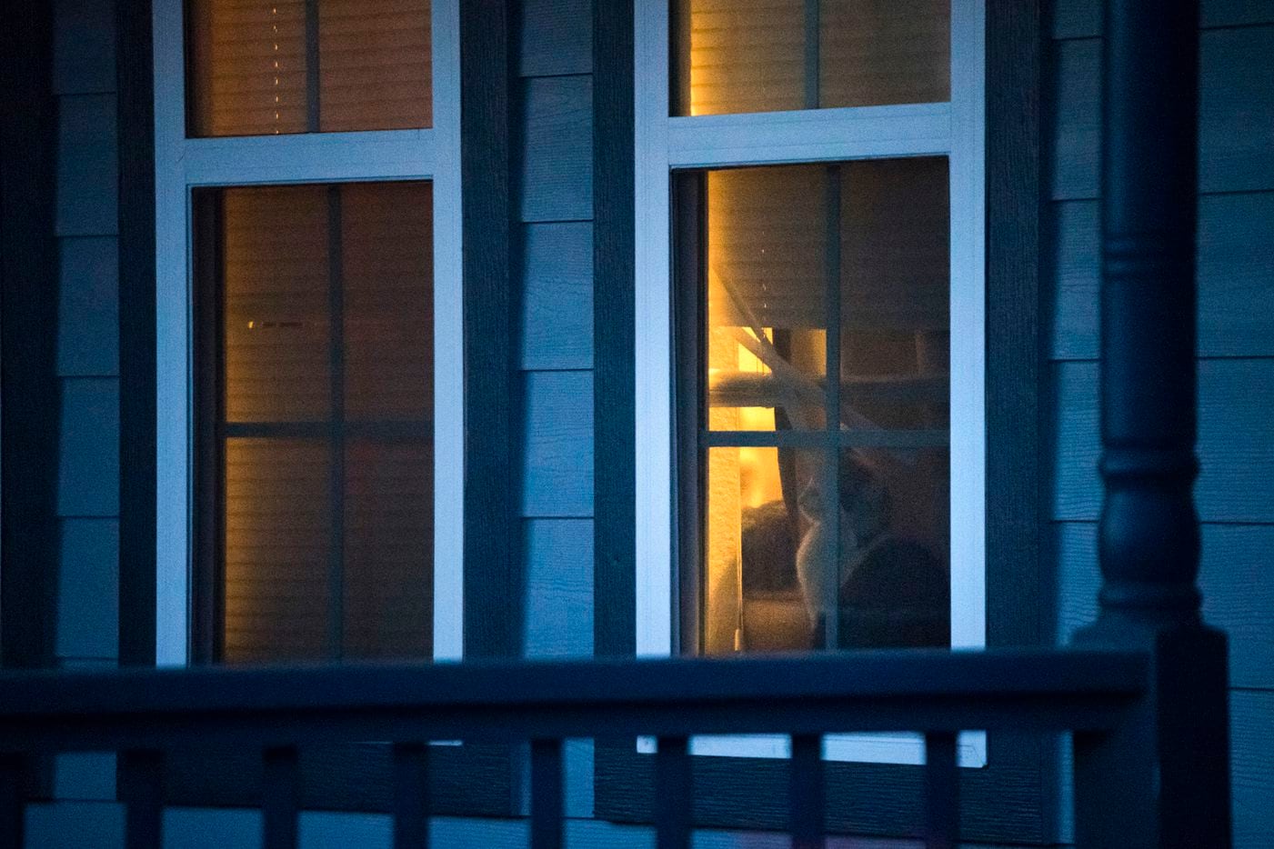 A cat is seen through the window of the house where Atatiana Jefferson was shot and killed...