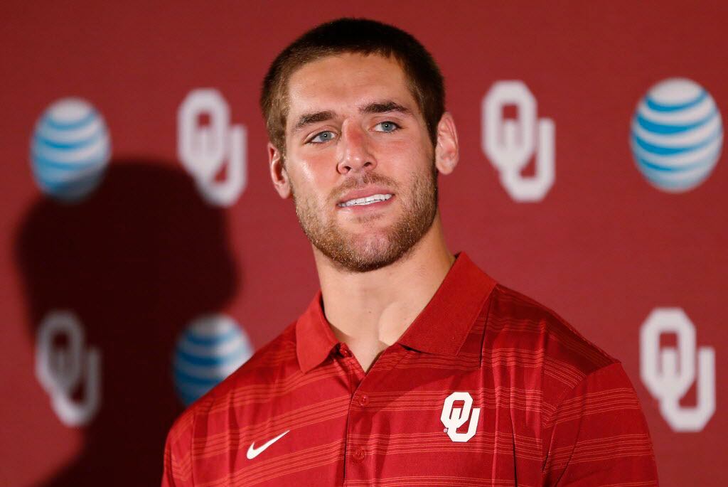 Quarterback Trevor Knight answers a question during a news conference in Norman, Okla.,...