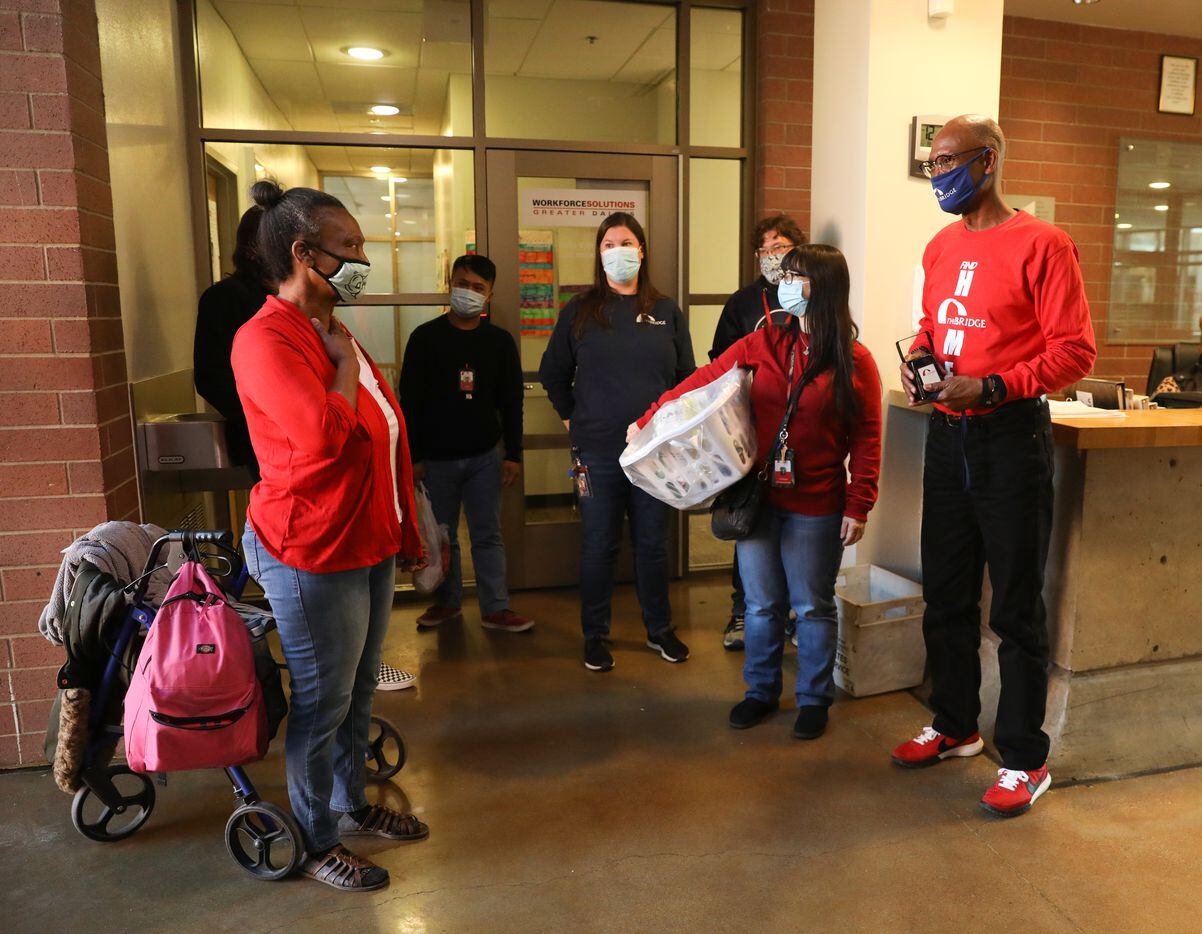 Patricia Freeman (left) thanks surrounding The Bridge Homeless Recovery Center staff for their assistance while she experienced homelessness at her apartment sendoff on November 19, 2021. (Liesbeth Powers/Special Contributor)