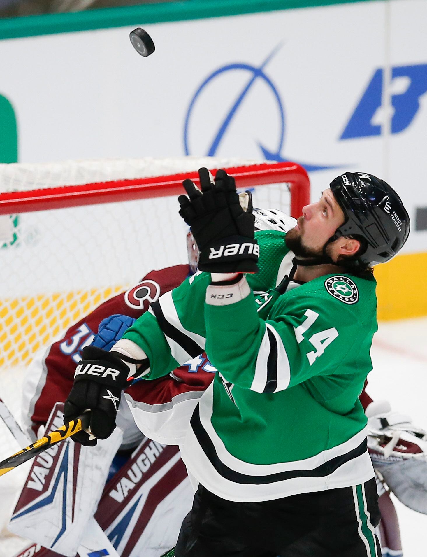 Dallas Stars forward Jamie Benn (14) catches an airborn puck during the first period of an NHL hockey game against the Colorado Avalanche in Dallas, Friday, November 26, 2021. (Brandon Wade/Special Contributor)