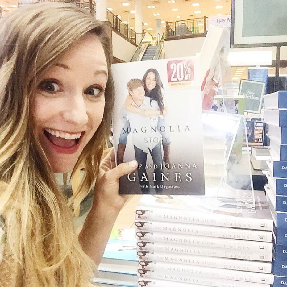 Dallas-based photographer Jess Barfield poses with a copy of Magnolia Story, a book published in October 2016 by Chip and Joanna Gaines and Mark Dagostino. Barfield grew up in Fort Worth and lives in Dallas. She took the photo on the cover of the New York Times and Amazon best-selling book about the stars of HGTV's Fixer Upper home improvement show from Waco, Texas. 