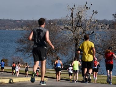 Runners alongside White Rock Lake during this year's BMW Dallas Marathon, Sunday Dec. 15, 2019 in Dallas. Ben Torres/Special Contributor