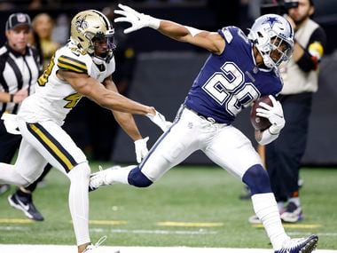 Dallas Cowboys running back Tony Pollard (20) scores on a long third-quarter touchdown run as he’s shoved by New Orleans Saints free safety Marcus Williams (43) at the Caesars Superdome in New Orleans, Louisiana December 2, 2021. The Cowboys won 27-17.
