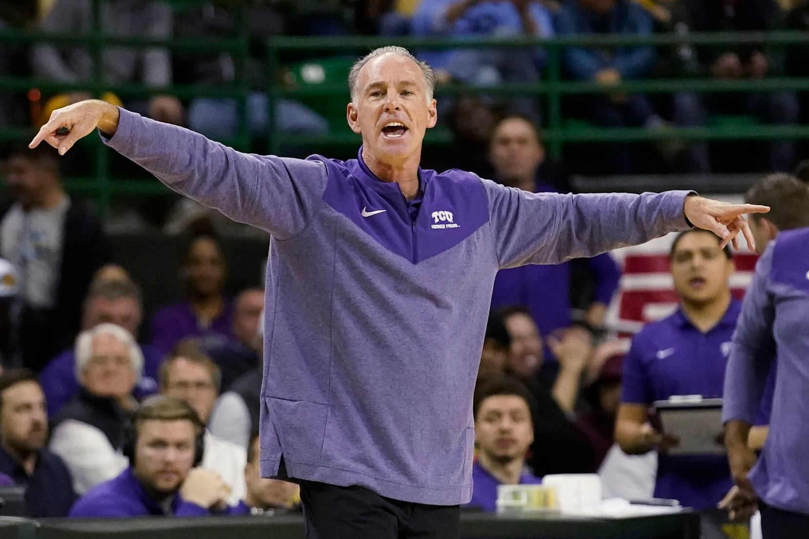 TCU coach Jamie Dixon gestures during the first half of the team's NCAA college basketball...