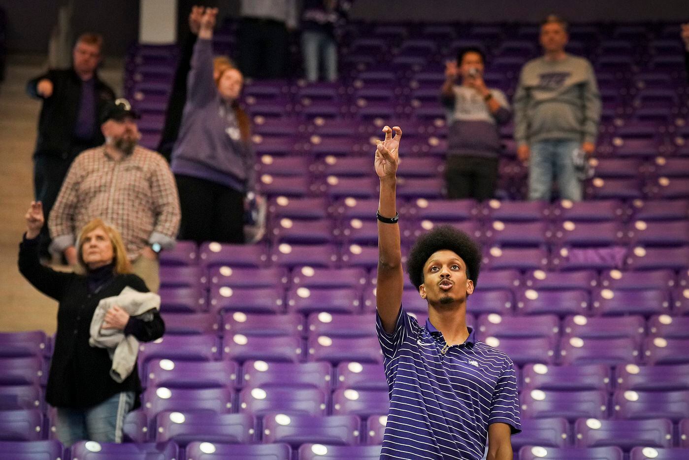 TCU fans stand for their school song after a loss to Georgia during a College Football...