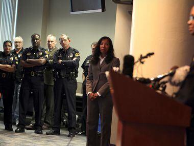 Police officers listen as new Dallas Police Chief David Brown addresses the media at Jack...