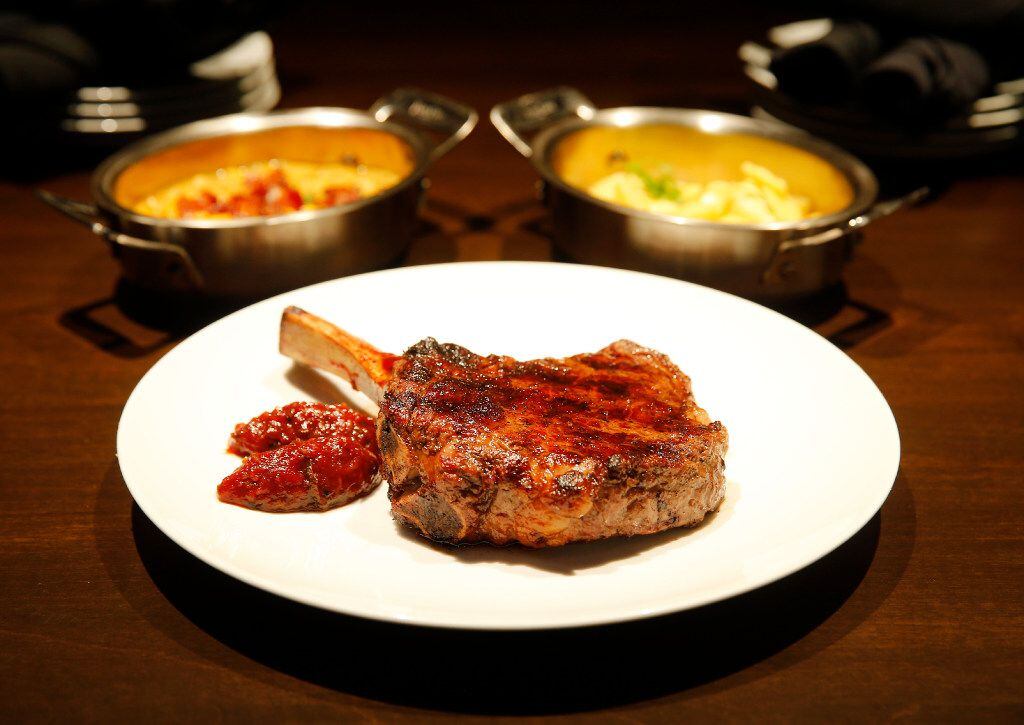 The mesquite grilled ribeye with tomato chutney is served here with mac and cheese and...
