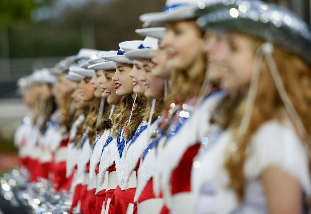 Members of the Parish Episcopal drill team line up for pre-game festivities on the field...