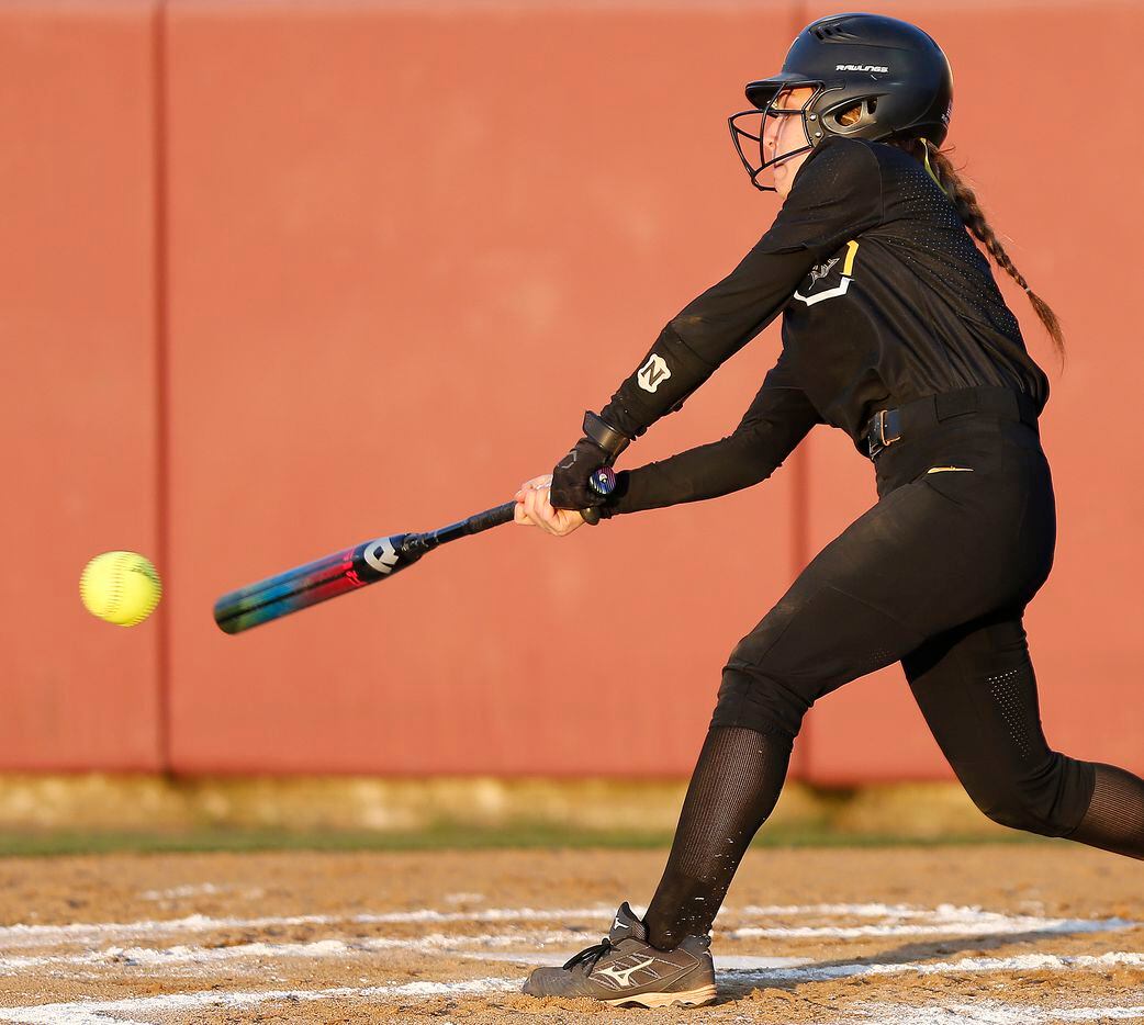 Memorial second baseman Ashley Camacho (2) gets a hit in the second inning as Heritage High School hosted Memorial High School for the District 9-5A softball championship in Frisco on Tuesday, April 20, 2021. (Stewart F. House/Special Contributor)