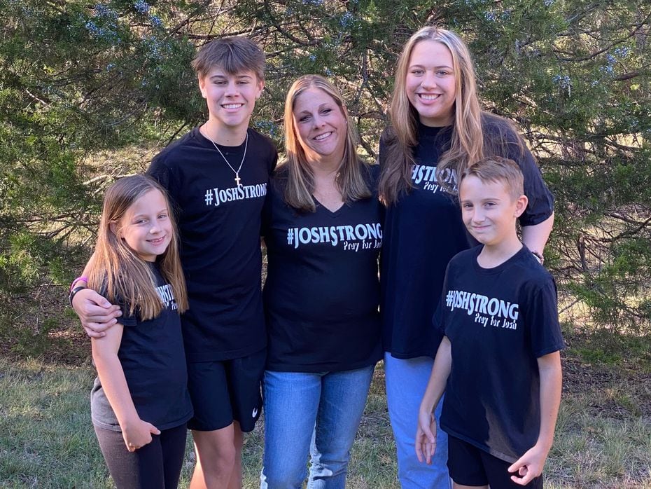 The Welch family poses in t-shirts that read 