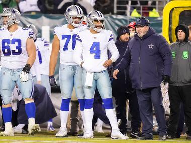 Dallas Cowboys quarterback Dak Prescott (4) waits to come into the game with head coach Mike McCarthy during the second half of an NFL football game against the Philadelphia Eagles at Lincoln Financial Field on Saturday, Jan. 8, 2022.