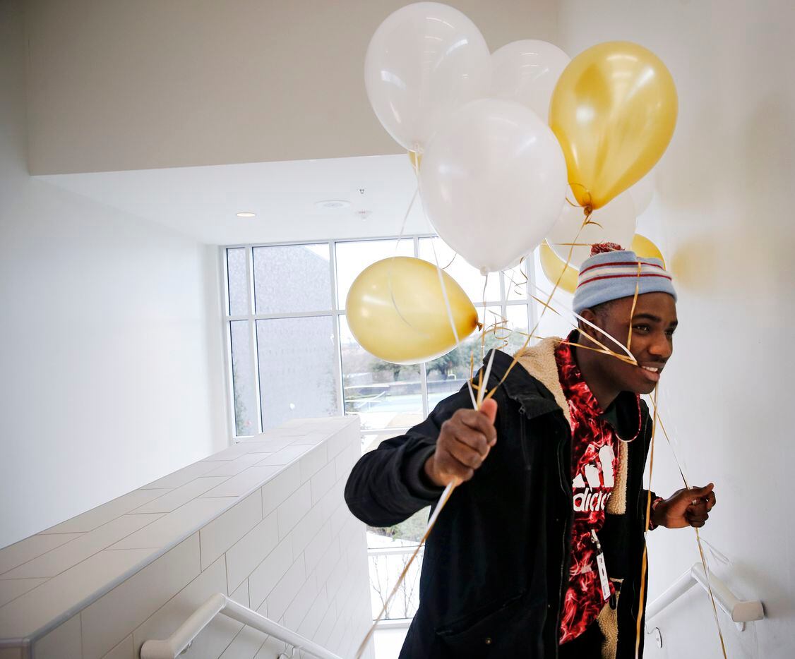 Kourtlan Freeman of Karays Gifts and Balloon Design delivers balloons to a reception...