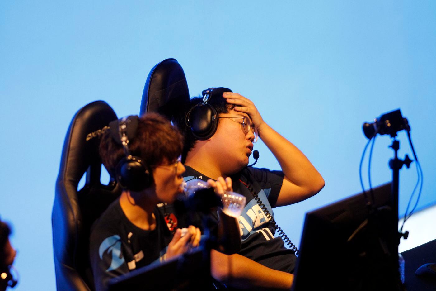 Dallas Fuel's Choi "Hanbin" Han-been, center, reacts after the team lost its 3rd straight...