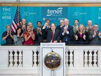 Tenet's Ronald Rittenmeyer (center) rang the opening bell at the New York Stock Exchange on...