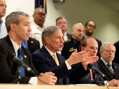Texas Gov. Greg Abbott, center, is joined by state and city officials as he gives an update on the coronavirus outbreak, Monday, March 16, 2020, in San Antonio.
