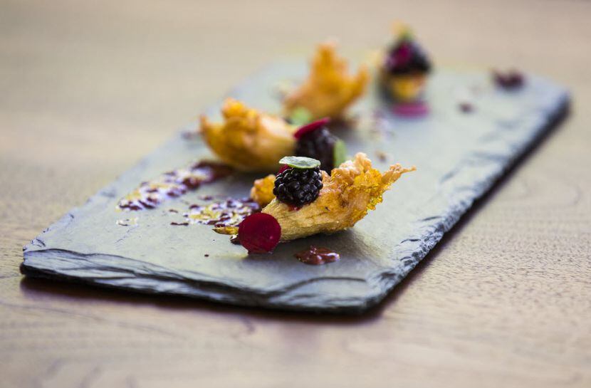 Pheasant stuffed squash blossoms with blackberry mojo and blackberries from the bar menu at...