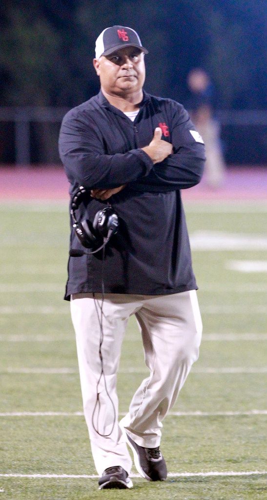 North Garland football coach Joe Castillo paces the sideline during the first half of the...