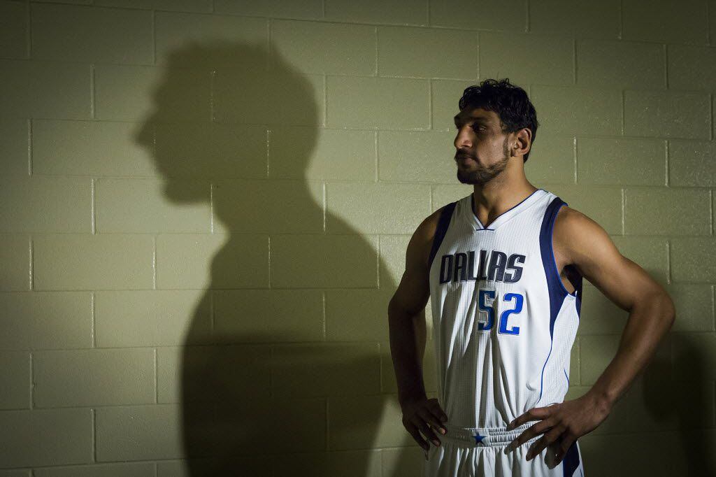 Dallas Mavericks draft pick Satnam Singh waits to have his picture taken during a team photo...