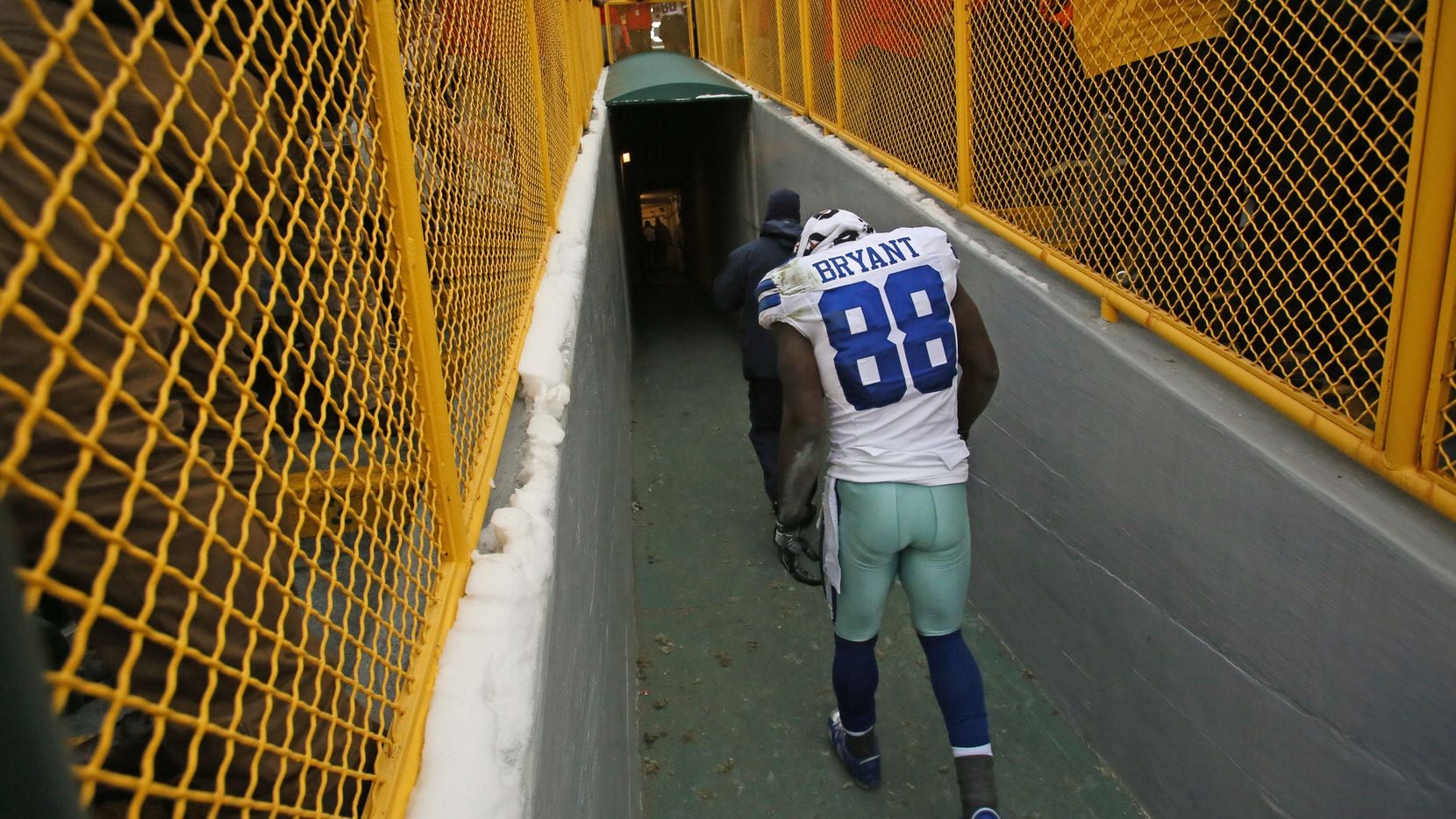 Dallas Cowboys wide receiver Dez Bryant (88) walks disconsolately up the players' tunnel...