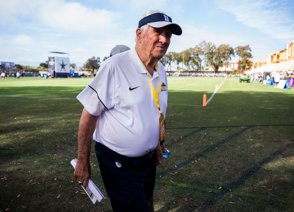Former Dallas Cowboys vice president of player personnel  Gil Brandt walks off the field...