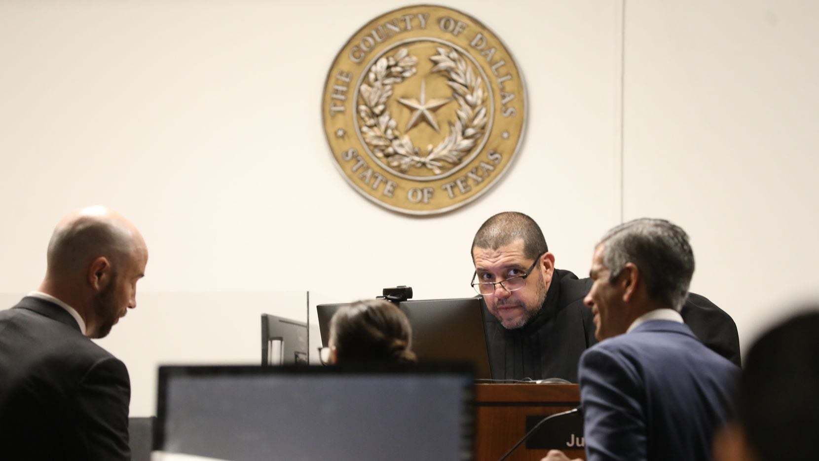 Attorneys speak with Judge Juan Renteria on June 17, 2022, in his courtroom at the George L....
