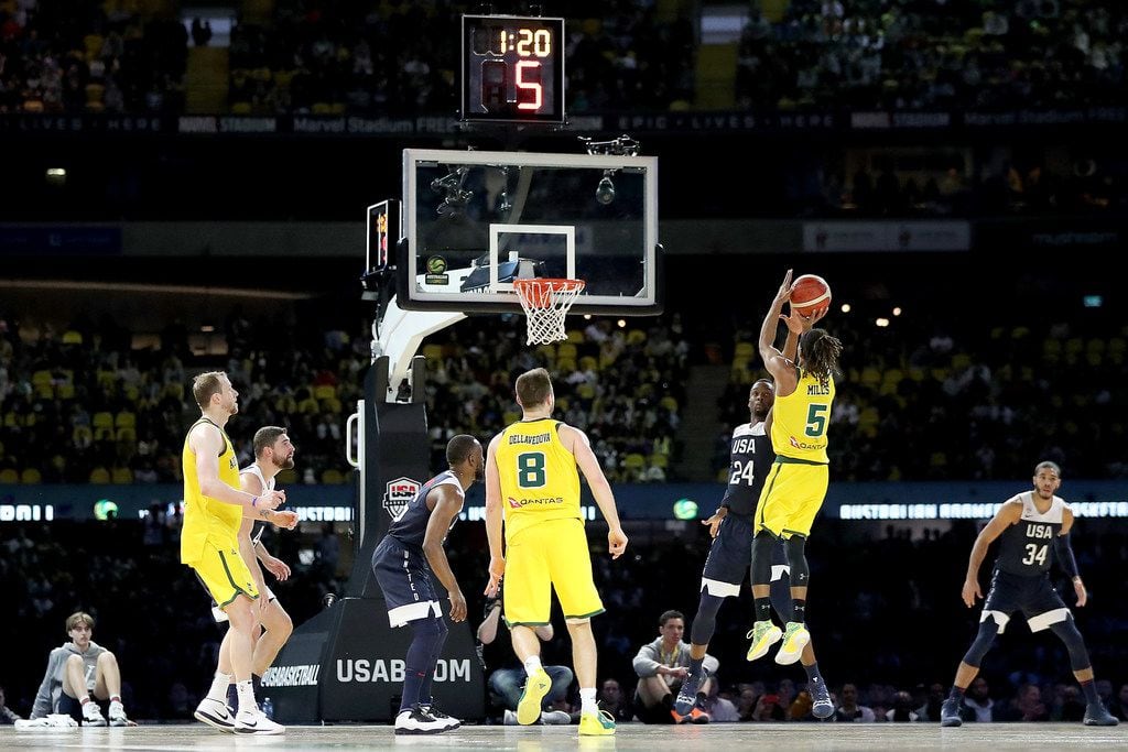 MELBOURNE, AUSTRALIA - AUGUST 24: Patty Mills of Australia shoots for three during game two of the International Basketball series between the Australian Boomers and United States of America at Marvel Stadium on August 24, 2019 in Melbourne, Australia. (Photo by Jonathan DiMaggio/Getty Images)
