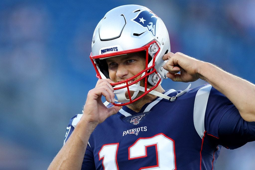FOXBOROUGH, MASSACHUSETTS - AUGUST 29: Tom Brady #12 of the New England Patriots looks on...