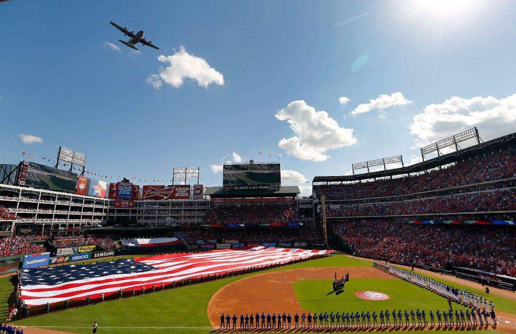 A C-130 from the 136th Airlift Wing Texas Air National Guard performs the flyover during the...