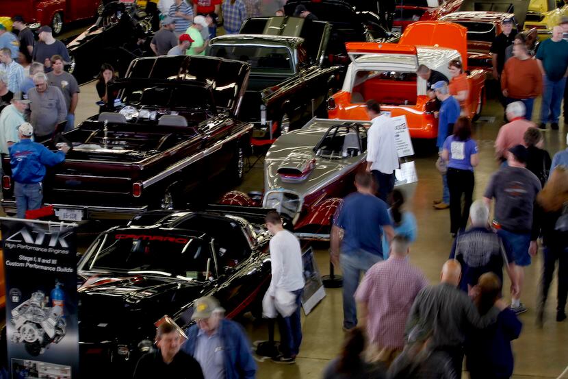 People look at the cars on display during the 54th annual O'Reilly Auto Parts AutoRama on...
